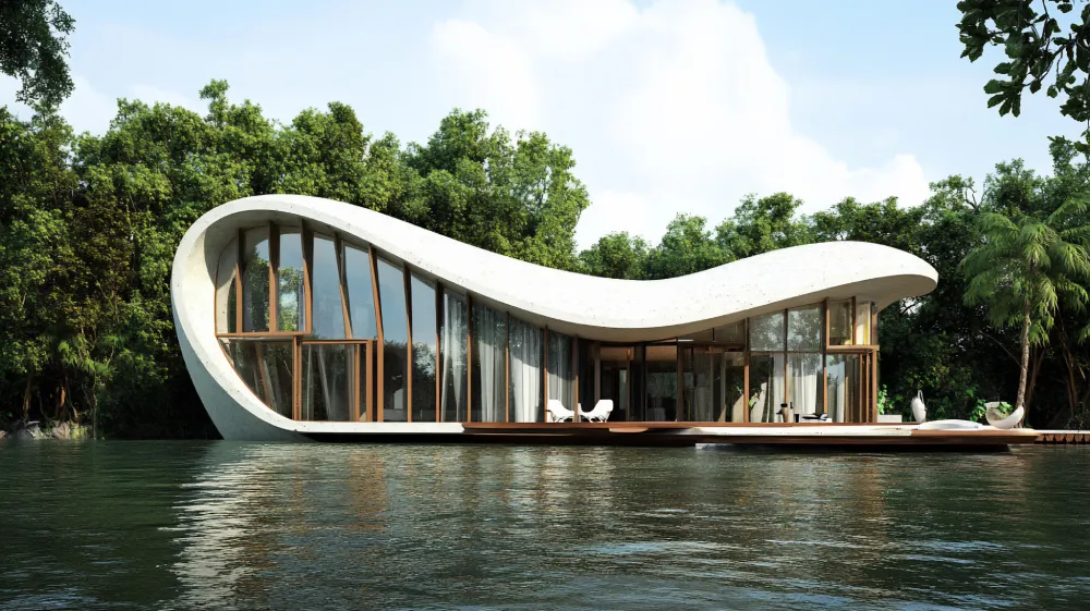 img-about-h1 - beachfrontcondopattaya Modern curved houseboat with large glass walls docked on calm water, surrounded by trees.