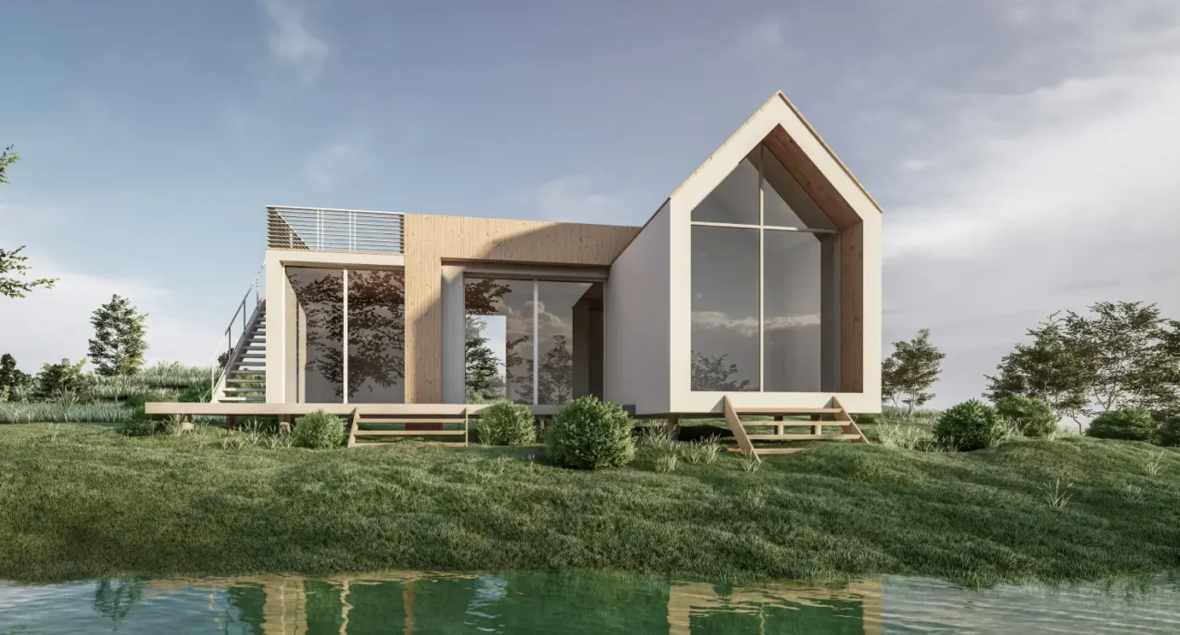 Modern two‑story house with large glass walls and a wooden accent, on a grassy bank by a calm pond.