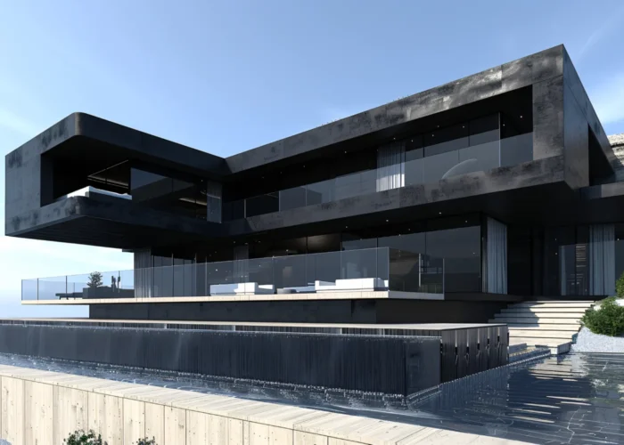 Modern black concrete house with large glass walls and cantilevered upper level, overlooking a terrace and water feature by the shoreline