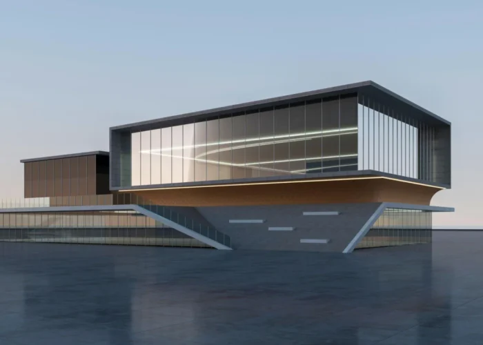 Modern glass-and-concrete building on a platform over water, with a cantilevered upper volume and stair access to the water level.